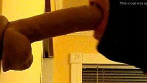 Passionate young gay man sucking a sex toy