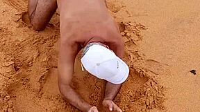 Public beach scene with a hot gay Latino hunk showing off his assets