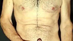 Gay man strips down and jerks off for the camera.