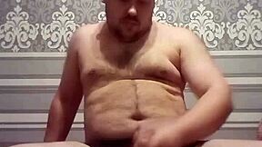 fat gay man stroking his handsome cock in solo action