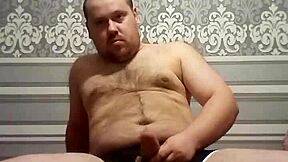 A gay man with an average body weight pleasuring himself
