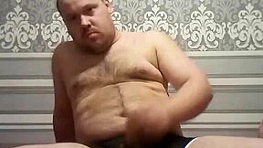 fat gay man stroking his handsome cock in solo action