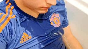 A young and attractive man urinates and then ejaculates on his face
