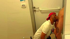Gay toilet scene with a hot blowjob and a facial finish