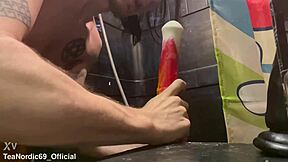 Young and straight twink gives a blowjob to a big cock toy in the form of a horse