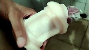 Guy stimulates massive cock with toy, imagining oral sex