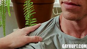 A hot guy is having fun with his roommate in their place