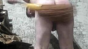 A fat Russian man endured a brutal spanking. His huge ass took a beating from a dirty broom.